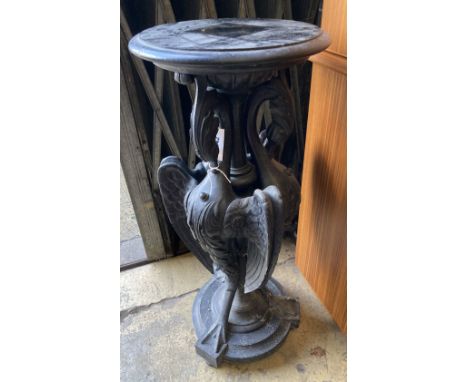 A Victorian ebonised carved wood lamp table in the form of three monopodiae stylised birds, 38cm diameter, height 94cm