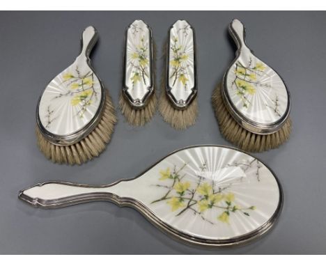 A 1950's silver and enamel five piece mirror and brush set, S.J Rose &amp; Son, London, 1954.CONDITION: Both hair brushes and