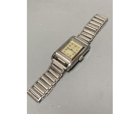 A gentleman's 1940's? stainless steel Omega manual wind wrist watch, with rectangular Arabic dial and subsidiary seconds, on 