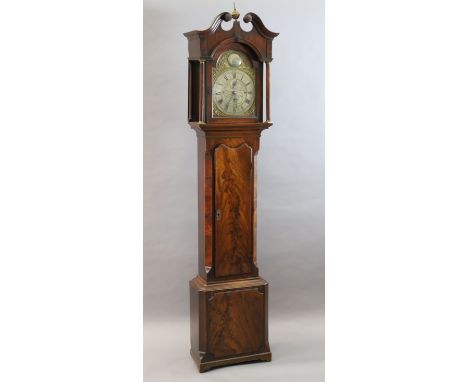 A George III mahogany eight day chiming longcase clock, the arched 12 inch brass dial with silvered eagle and tempus fugit pl