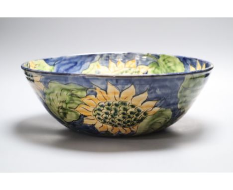 A Paul Jackson studio pottery Sunflower bowl, signed, diameter 36cmCONDITION: There is crazing visible throughout