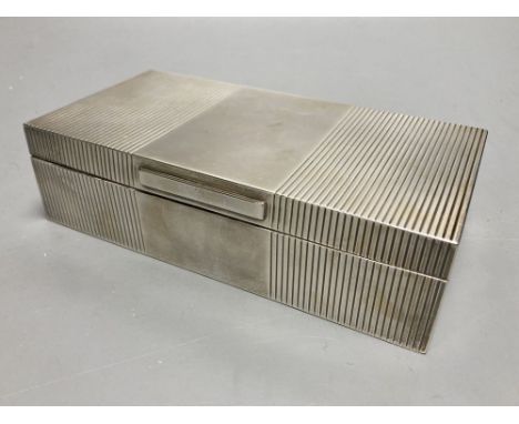 A George VI ribbed silver mounted rectangular cigarette box, Mappin &amp; Webb, London, 1946, 17.8cm.CONDITION: Some minor su