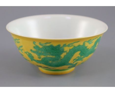 A Chinese green and yellow 'dragon bowl', Qianlong seal mark and possibly of the period, diameter 12cmCONDITION: Good quality