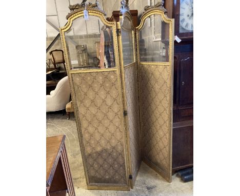A Louis XVI style carved giltwood three-fold dressing screen, each panel width 47cm, height 182cm