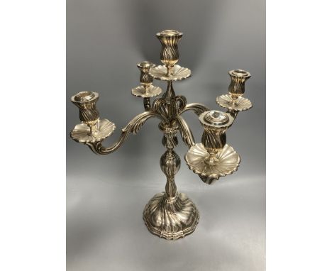 An early 20th century continental 830 white metal four branch, five light candelabrum, height 47.4cm, sconces missing??, gros