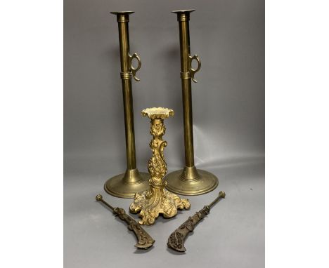 An 18th century French ormolu candlestick, 25cm, a pair of 19th century tubular brass ejector candlesticks, 46cm and two Chin
