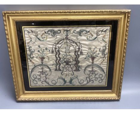 A Regency silk panel, embroidered with a bird cage and scrolling flowers and foliage, framed, 29 x 35cm