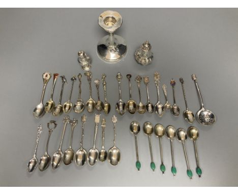 A silver dwarf candlestick, two silver condiments and a group of assorted silver, white metal and plated mainly commemorative