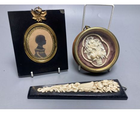 A Cantonese carved ivory basket of flowers, framed, Dieppe carved ivory applique panel and a Victorian portrait silhouette, 1
