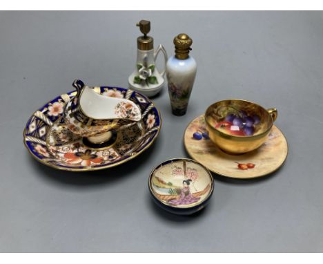 A Royal Worcester miniature cup and saucer painted with fruit, signed W. Hale, height 4cm, two scent bottles and sundries