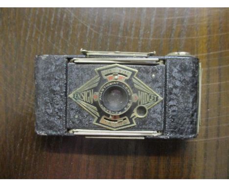 An Ensign Midget folding camera 