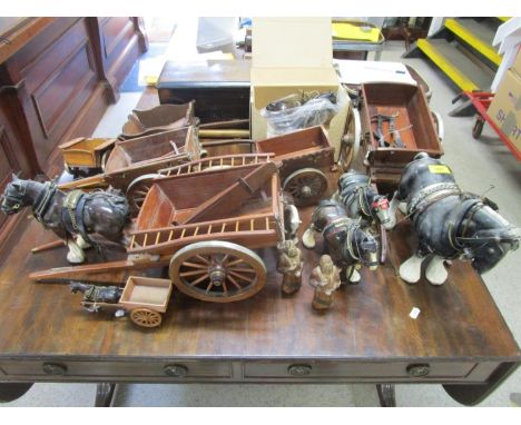 A collection of Melba ware and other model cart horses and wooden carts 