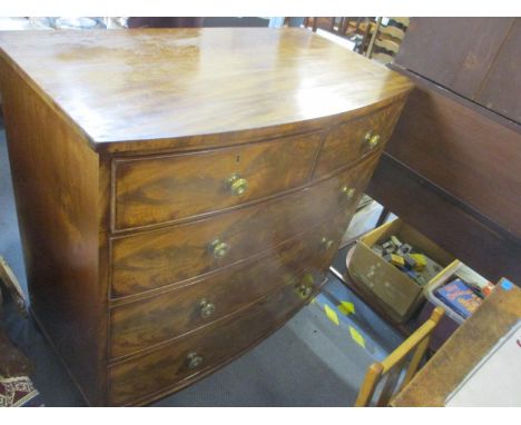 A 19th century flame mahogany bow fronted chest of two short and three long graduated drawers on turned legs 41.5cm x 41.5cm 