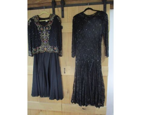 Two Simon Ellis evening dresses circa 1980, the first example comprising a long black sleeveless dress with additional long s