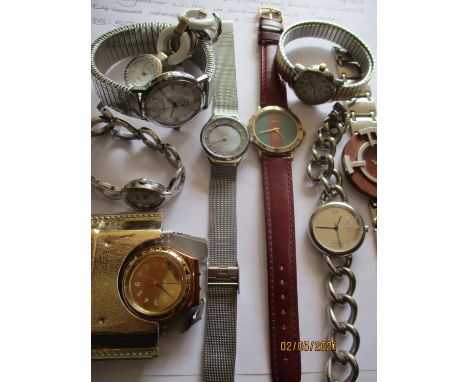 Modern watches to include a ladies gold and silver tone wristwatch, a gents Logo watch with a wooden dial, a ladies gold tone