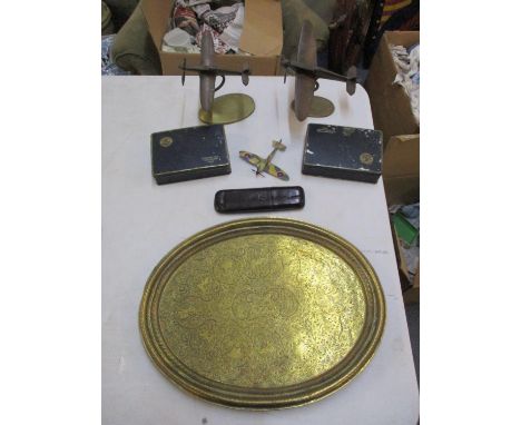 A mixed lot to include two vintage brass desk tip models of spitfires, a vintage Indian brass tray, two vintage cigarette tin