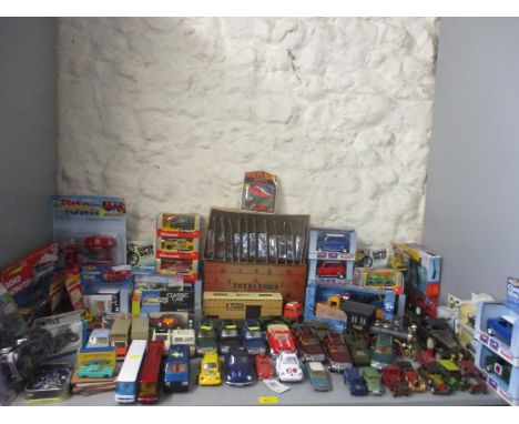 A collection of various boxed and unboxed diecast model vehicles and other toys to include a boxed Matchbox Lincoln Continent