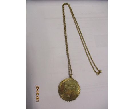 A 9ct gold chain 11g, having an yellow metal pendant, stamped 9ct, with an image of the horoscope Leo the Lion, 19.7gLocation