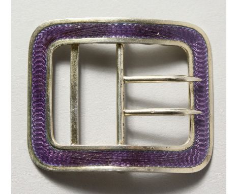 A silver and blue enamel buckle.