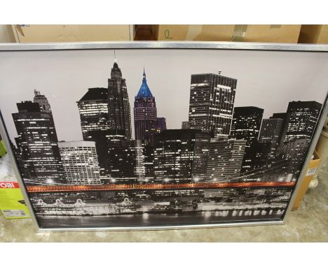 A large photographic print depicting the New York skyline.