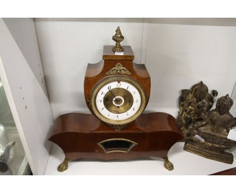 A late 19th century French mahogany mantle clock with twin porcelain dials.