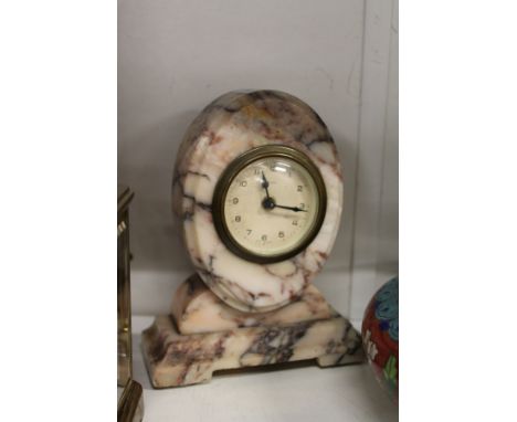 A small alabaster mantle clock.