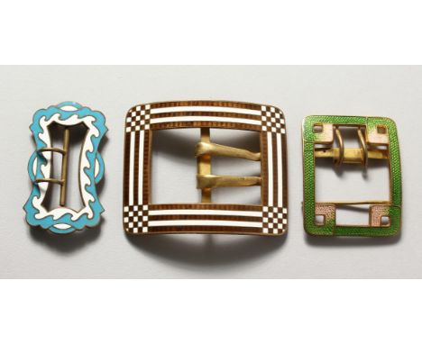 Three large enamel buckles.