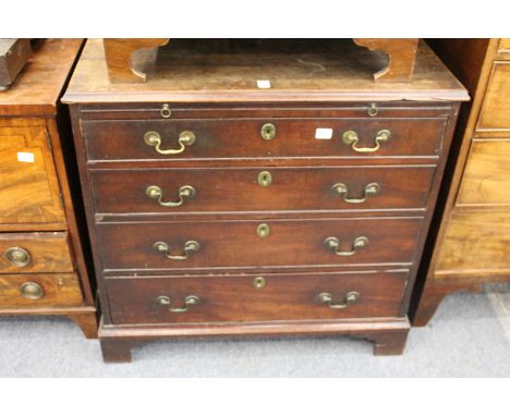 A George III mahogany bachelor's chest with brushing slide over four graduated long drawers, on bracket feet.