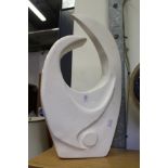 A white painted plaster sculpture.