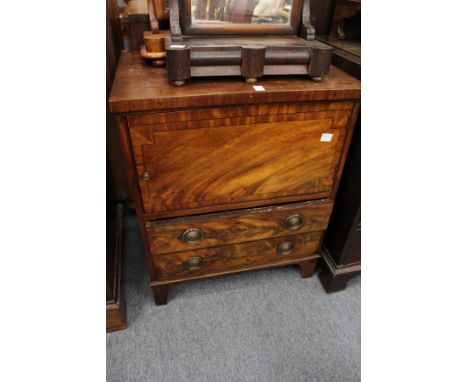 A 19th century mahogany commode with a single door and two drawers.