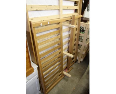 A modern light oak bedframe.