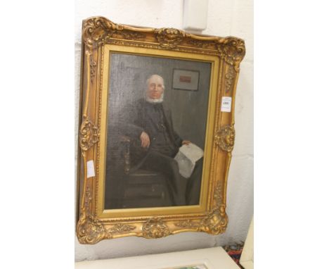 A portrait of an elderly gentleman seated in a chair oil on canvas in a decorative gilt frame.