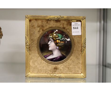 A good Limoges small circular enamel portrait plaque of a lady in a gilt frame.