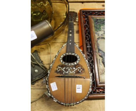 A mandolin with mother-of-pearl inlaid decoration.