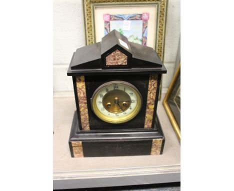 A Victorian slate mantle clock.