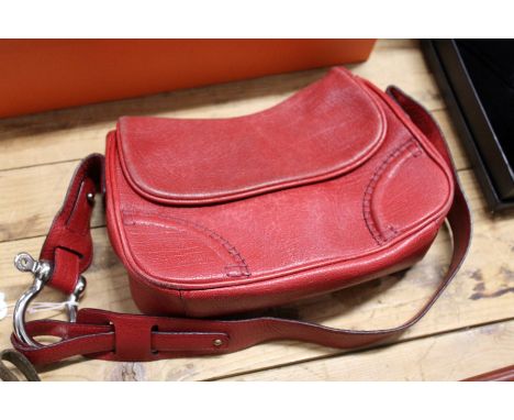 A Burberry red leather handbag.