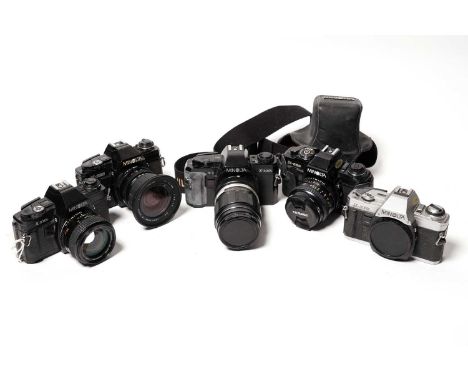 Five Minolta SLR film-camera bodies; an MC Rokkor 50mm f1.4 lens; and three other Minolta-fit lenses by independent makers.