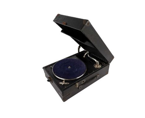 A Linguaphone tabletop gramophone, with a fitted pocket for storing records to the interior of the hinged lid, in fitted case