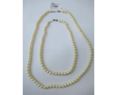 Single row uniform cultured pearl necklace, 23ins long approximately together with another similar, 14.75ins 
