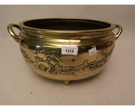 19th Century Chinese polished bronze two handled shallow bowl decorated in relief with landscapes (repairs to rim), 16.5ins w