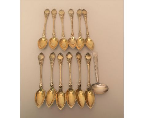 Set of twelve Continental silver teaspoons, together with a similar feeding spoon, 9ozSome light scratching to each spoon oth