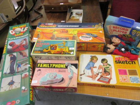 Quantity of various boxed toys including Matchbox rescue van, Etch A Sketch, Marx record player, family phone, pro shot and C