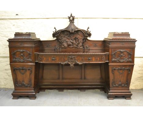 Fine 19th Century mahogany twin pedestal sideboard of Chippendale revival form, circa 1880, the ornate back carved in deep re