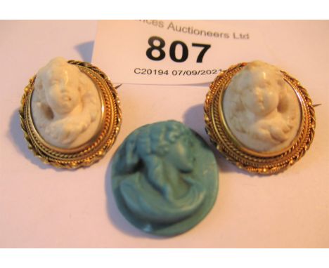 Pair of Victorian small gold mounted oval relief cameo portrait brooches, together with a blue unmounted ceramic portrait pla