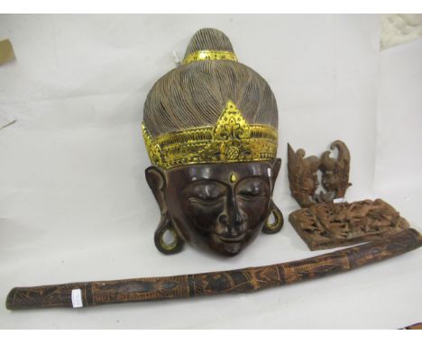 Large carved and painted wall mask in the form of a head of Buddha, 24ins high together with a didgeridoo and two other orien
