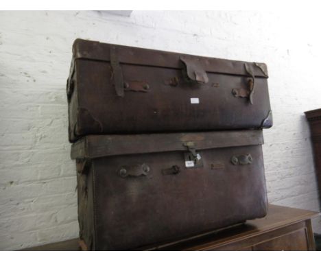 19th Century leather trunk with brass lock (at fault and lacking straps), 18ins high x 33ins wide x 21ins deep together with 