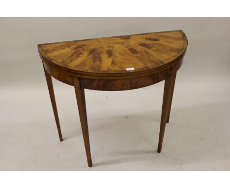 19th Century satinwood card table in Sheraton style having segmented veneered top with crossbanded edge and baize lined inter