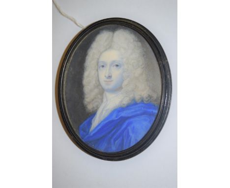 Attributed to Benjamin Arlaud, watercolour portrait miniature of a young man wearing a blue coat, 80mm x 65mm approximately, 