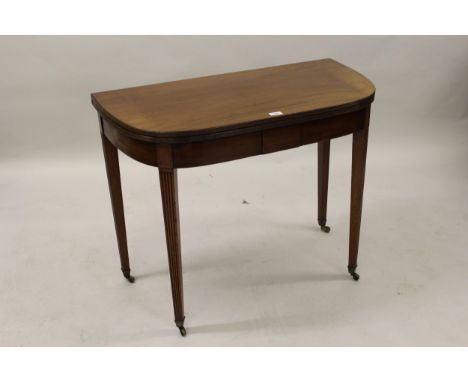 George III mahogany and black line inlaid D-shaped fold-over card table, on square reeded tapering supports with brass caster