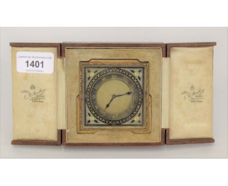Good quality Art Deco gilt brass travel clock with Champleve enamel decoration, in original leather fitted travelling case 